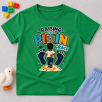 Raising This Pikin by Grace Christian kids shirt in green featuring a child illustration and playful Nigerian parenting message
