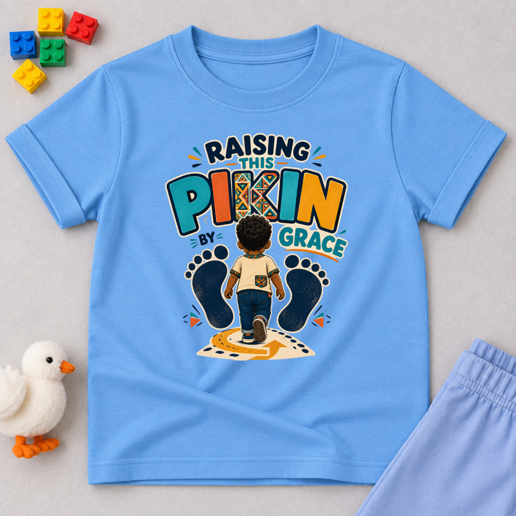 Raising This Pikin by Grace Christian kids shirt in light blue featuring a child illustration and playful Nigerian parenting message

