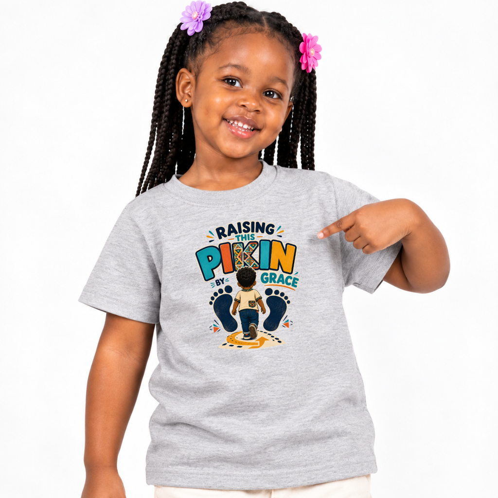 Raising This Pikin by Grace Christian kids shirt in light grey featuring a child illustration and playful Nigerian parenting message
