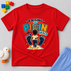 Raising This Pikin by Grace Christian kids shirt in red featuring a child illustration and playful Nigerian parenting message
