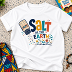 Salt of the Earth Christian kids shirt in white featuring salt shaker illustrations and bold faith-inspired lettering
