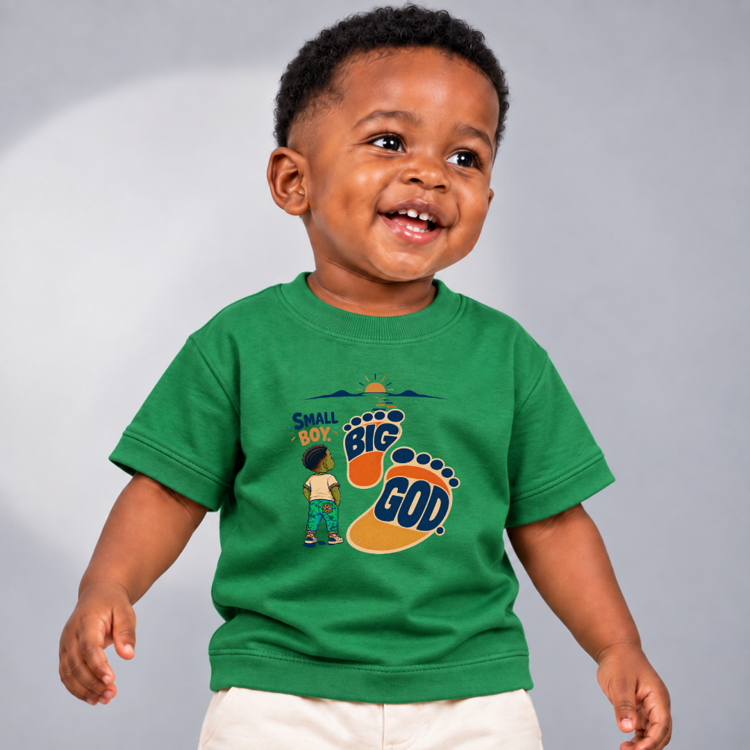 Small Boy, Big God Christian kids shirt in green featuring a child illustration and oversized footprint
