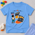 Small Boy, Big God Christian kids shirt in light blue featuring a child illustration and oversized footprint
